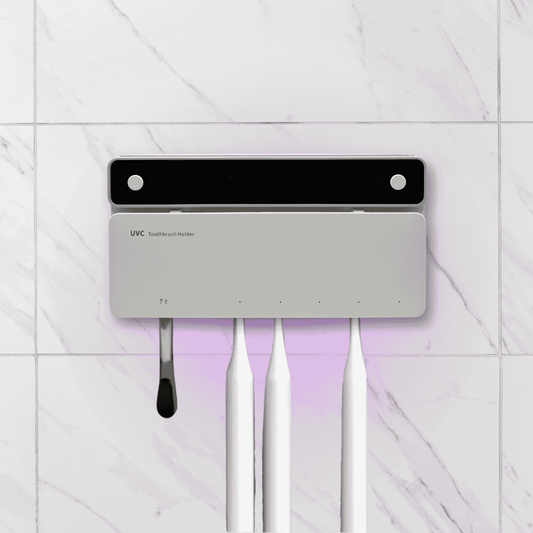 UVC toothbrush holder with UV light on a white tiled wall background