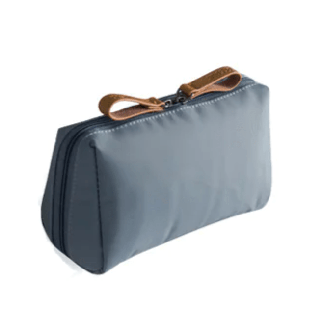 Blue toiletry bag with a brown zipper on a white background