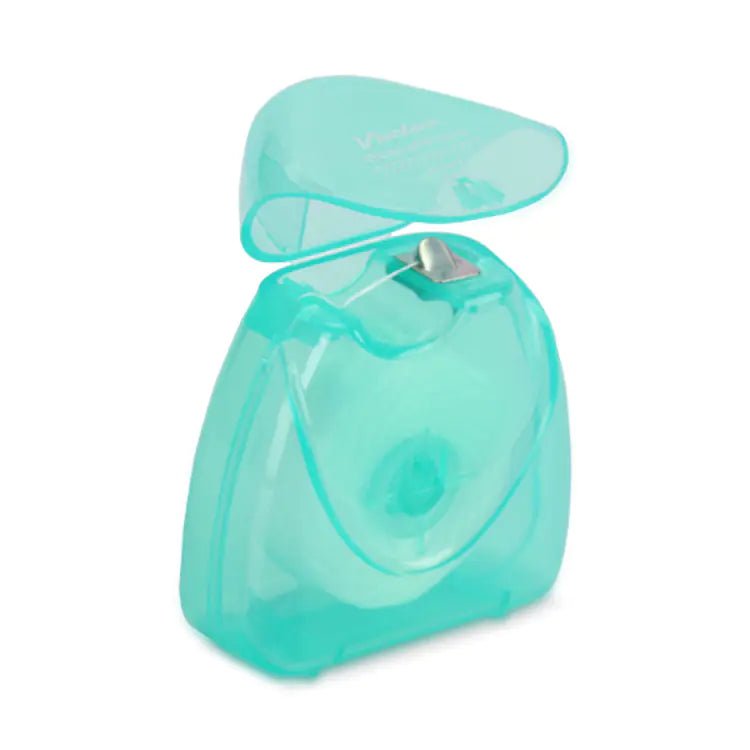 Turquoise dental floss container on a white background