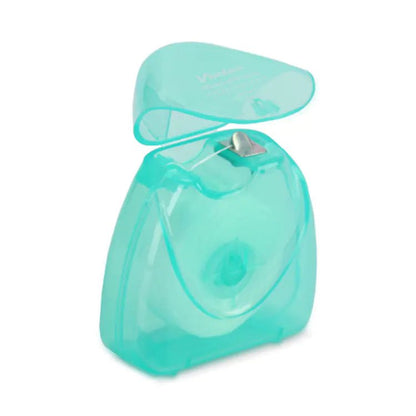 Turquoise dental floss container on a white background